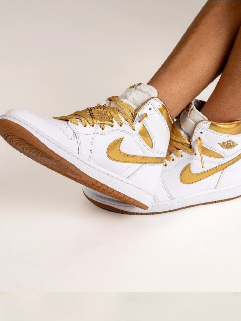 Women's Nike Air Jordan 1 Mid in White and Gold - Picture 1 of 6